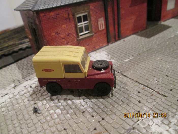 A Land Rover Series II, B R ime in pre-1956 crimson and cream. Used for cross-country routes - farm tracks often unsuitable for normal road vans or bad weather (lots of hilly land and steep banked fords)