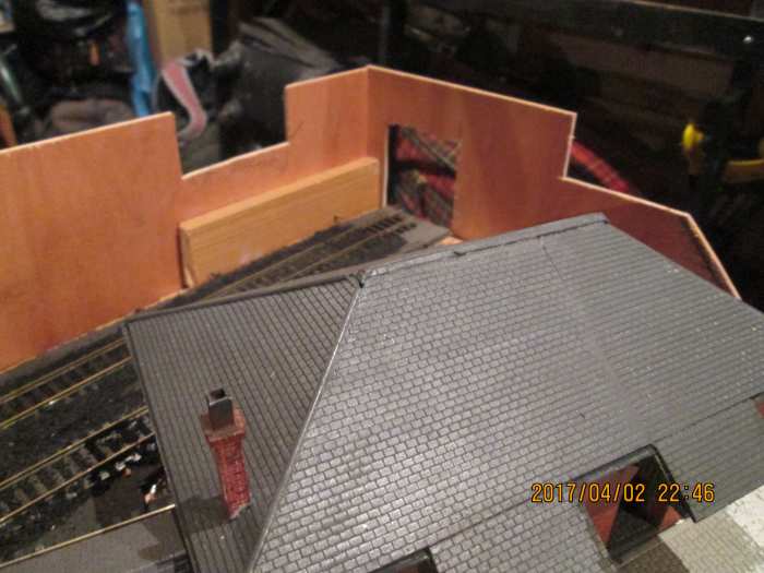 Behind the goods shed cut-outs were made where the 'back road' comes in and leaves the scenery, the batten serves to screw the corners together and support another to build the smaller overbridge onto. Cut out near the corner for exit to fiddleyard