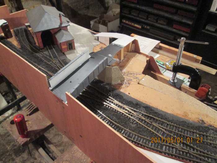 Bird's eye view of the girder bridge from the back, shows the ramp at the front of the layout that leads down to the goods depot.