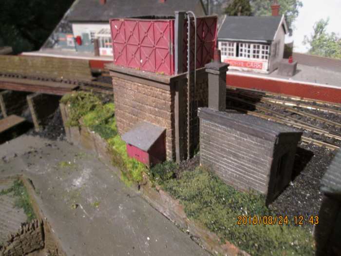 Nearly forgot - added a water tower. Knew there was something missing. A water crane for the platform should complement it, when I can find one that I stripped from 'Thoraldby' before it was taken away (for a new life as a Buckinghamshire station).