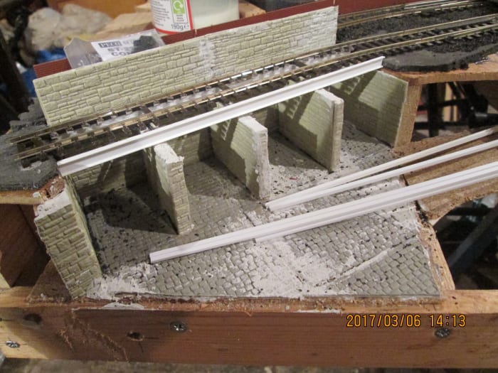 Coal depot takes shape. Track fixed down against the back support to allow space for gangway timbering. Struts along the tops of the cell walls will separate cells and support intermediate sleepers. Front ribbing to follow