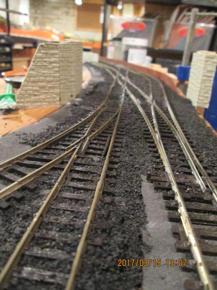 Ballasting done past the pointwork on the 'Up' end At left is the way into the goods shed where a wagon weigh bridge should be added in front of the office window. Centre is the shunt road, right is the 'Up' road out (probably under a skew bridge)