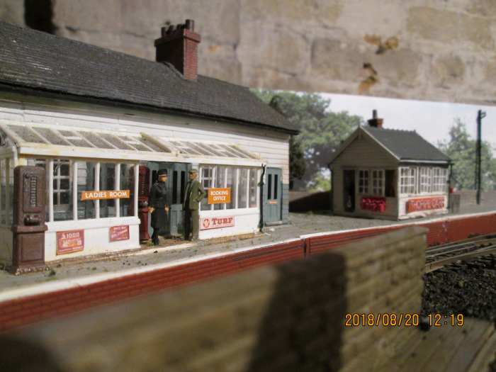 Station offices and waiting room with reinstated signal cabin. In the foreground is the coal depot wall to stop coal dust being blown onto passengers - a consideration witnessed across the region where coal depots were close to passenger facilities