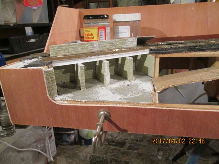 Close-up of the coal depot corner, with the casing cut out to ground level and modelled around the end wall - the gap here also to be filled in.