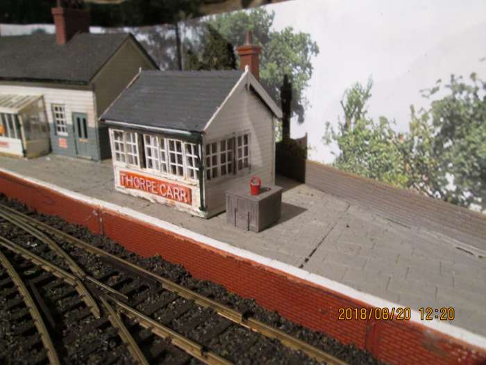 The signal cabin has 'acquired' a coal bin, that someone's left a fire bucket on top of. No sign of a station cat yet.... Water crane to be added at this end of the platform for thirsty engines (don't want Thomas to go dry now, do we lads'n'lasses?)