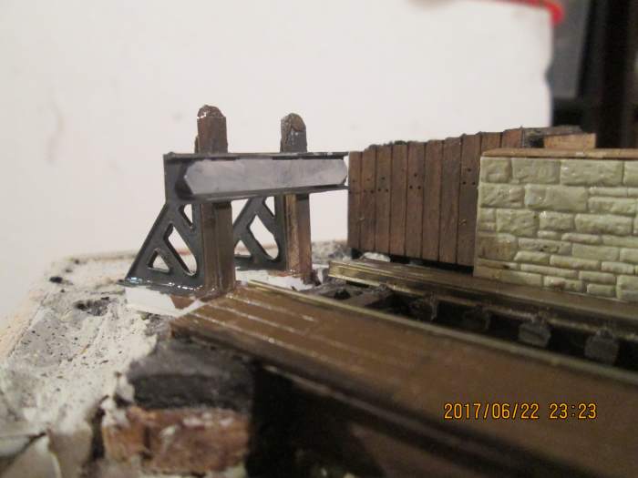 The end of the line... One of the pairs of cast brass North Eastern Railway style buffer stop sides from Slaters now completed, with plastic posts and beam from the Evergreen strip styrene range... seen from from front