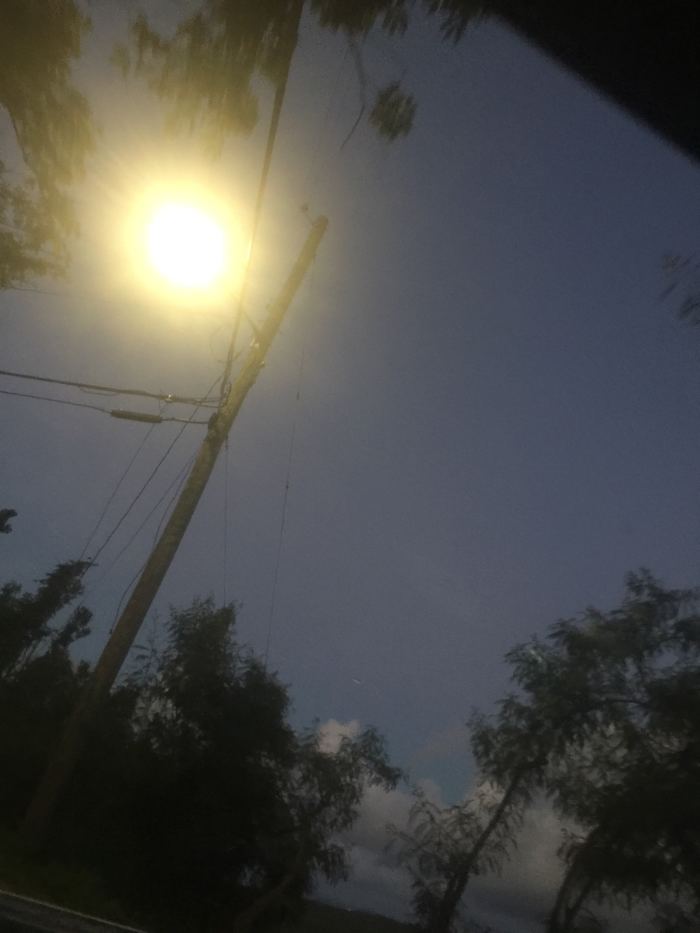 On November 25, 2017, captured a sunbow of the color yellow, orange and a light red @5:57pm. Arrived home at the driveway, when I spotted the rainbow.