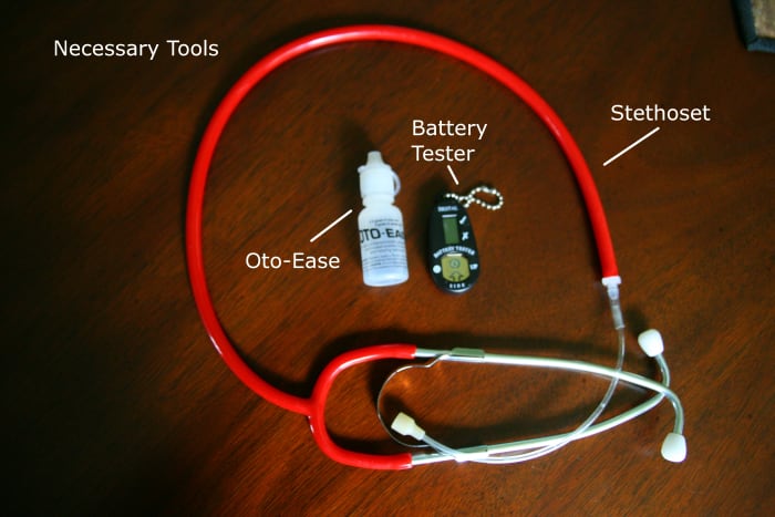 A stethoset, battery tester, and some lubricant (like Oto-Ease) are helpful tools when putting in a child's hearing aids.