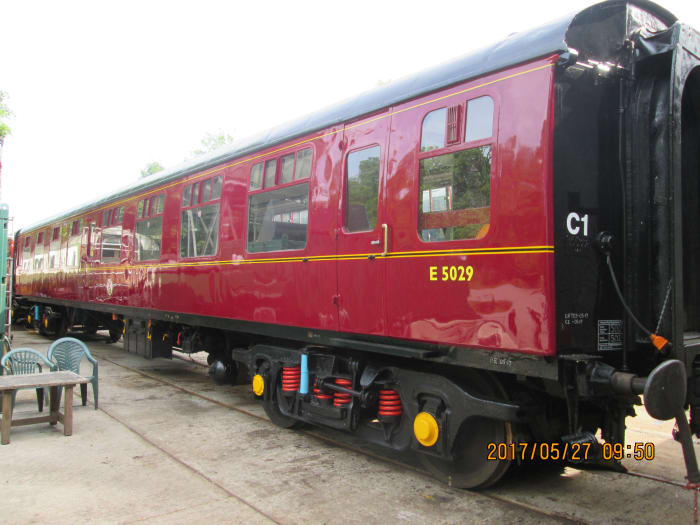 Beautifully restored 2nd generation British Railways open carriage with Commonwealth bogies, Timken roller bearings. Vehicle was privately bought, probably brought on a low-loader, liveried 'chocolate and cream' (Western Region) now with 'E' prefix