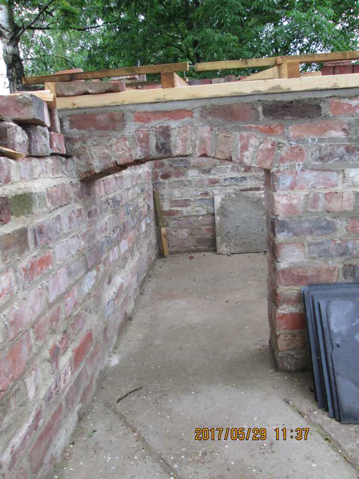"Here piggy!" A stylishly constructed archway to the porkers' des. res. accommodation. The roof will be slate-covered
