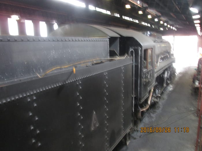 Looking down from the catwalk beside the shed shop, here's a visitor from another preserved railway, a US Transport Corps' Baldwin 2-8-0