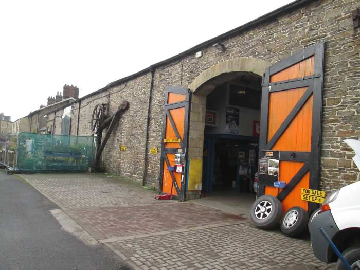 What was once one of the doorways to the goods shed now gives access to a motor workshop. The other one (left) leads to a garden centre