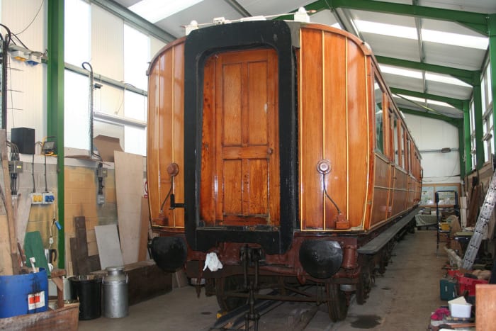 Work complete on a carriage, the corridor connection sets off the panel work and underframe paintwork