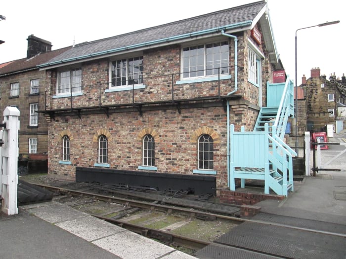Using recycled bricks from Whitby Town's three-storey signal cabin, Grosmont's 1990 built brick signal cabin controls the crossing gates as well the NYMR signals to the new gantry on the Whitby end of the station