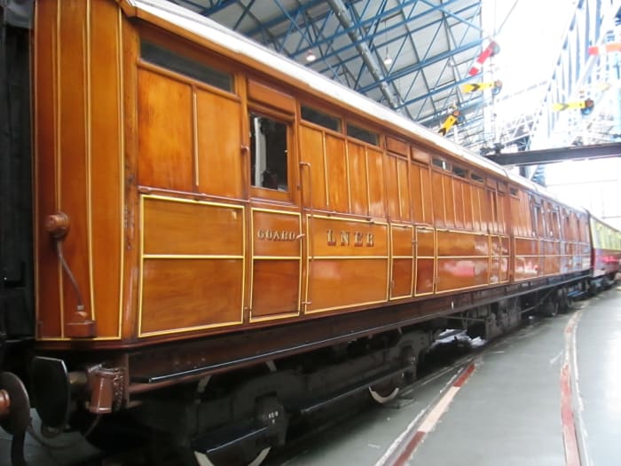 Next to the ECJS carriage above, a brake 3rd Class highly varnished teak bodied Gresley LNER carriage - note the handsome white-wall wheels, finishing as standard in the 20s