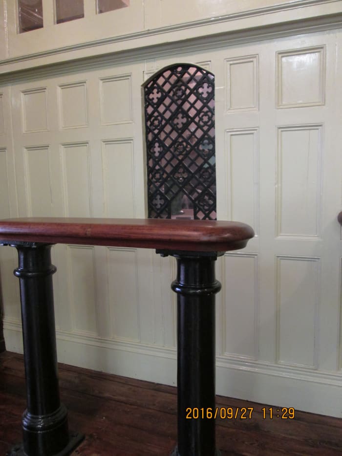 The general public bought their tickets at these ornate windows (cut out at waist level for passing tickets and cash- how did they manage without plastic?) The high shelf was for ladies to put their bags whilst they fished for their purses.
