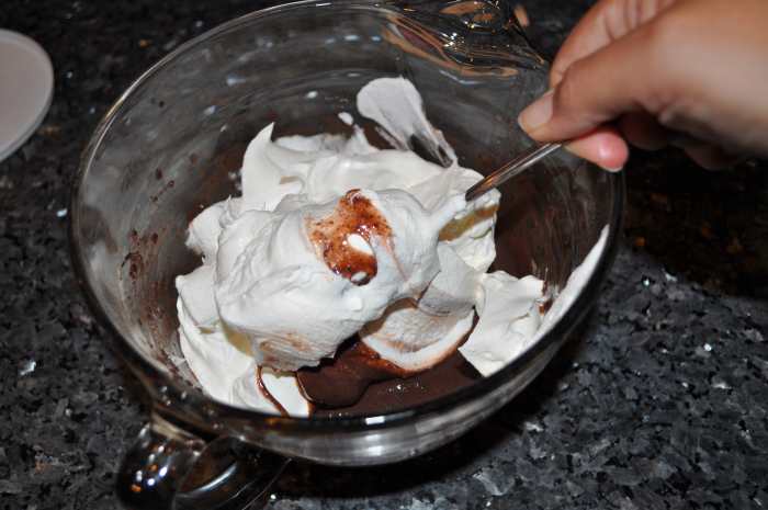 Whip in the cool whip. Make sure to get all parts of the pudding otherwise some parts will be stronger than others, but don't over mix.