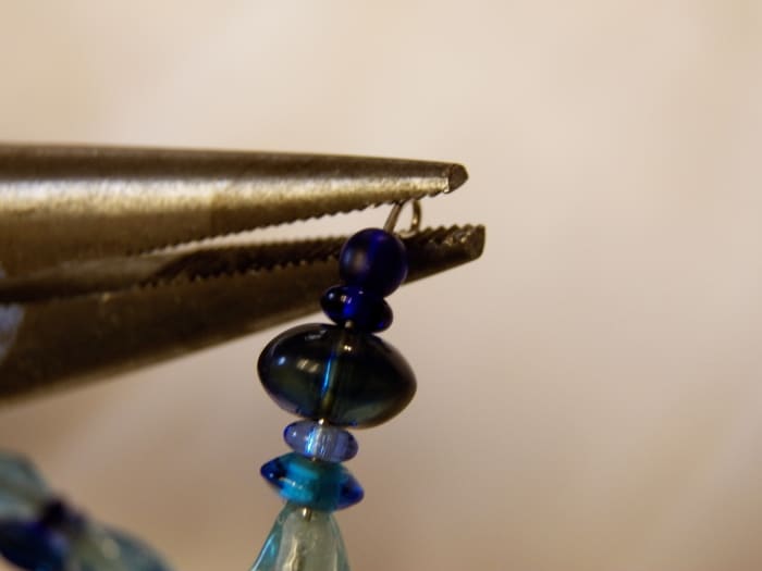 Use pliers to bend the wire backwards at both ends so beads don't come off the bracelet.