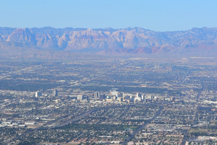Looking west from Frenchman Mountain across Las Vegas. Las Vegas Strip (center). Red Rock Casino and beautiful Red Rock Canyon are in the distance.