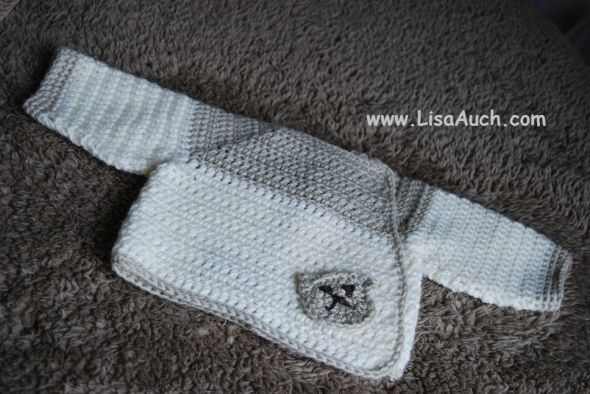 Baby Bear Crochet baby cardigan. This is made from the TOP down and all in one piece. It is a simple Beginners easy to understnd pattern.