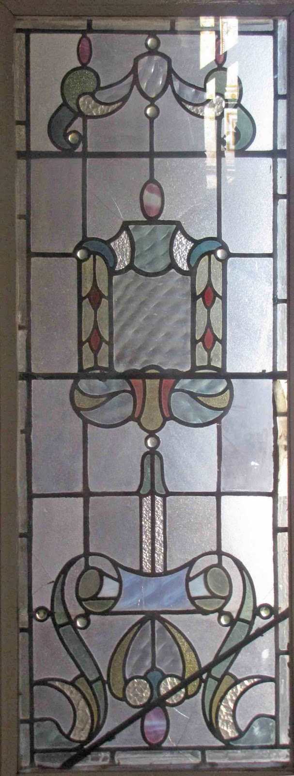 Slight color adds even more charm to this antique leaded glass window