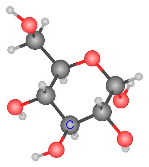 Ball and stick model of a glucose molecule. Dark gray balls are carbon atoms, red balls are oxygen atoms and small light gray balls are hydrogen atoms
