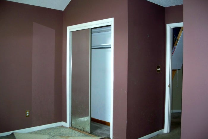 Before: Dark brown walls, carpets ruined by pets and mirrored closet doors needed replacing.