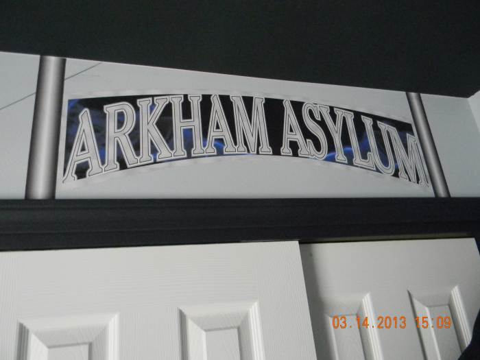 This is the Arkham Asylum sign that is attached over the closet. It was printed on indoor polypropylene and attached with DIF wallcovering adhesive. Here is where Batman places all the villians...and clothing...and toys.
