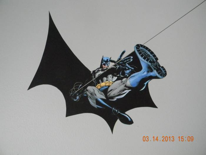 Here you can see 1 of the 2 Batman designs in the room. They were printed on the indoor polypropylene and attached with the DIF wallcovering adhesive. The Dark Knight is swing down on Arkham Asylum.