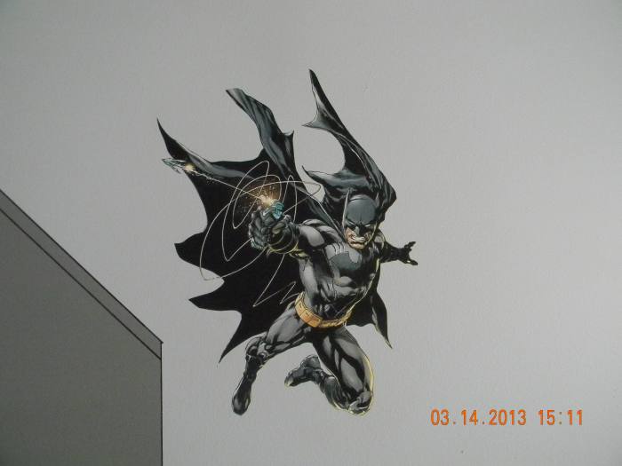 Here you can see 1 of the 2 Batman pieces that was printed on indoor polypropylene and attached with DIF wallcovering adhesive. This one is swinging down on the Gotham skyline.