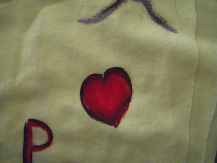 Work on practice fabric first. This is my first blending attempt using black and red. First, I put the black down. Second, the red. I used my finger to blend the colors while they were still wet, moving from the dark edge towards the center of the he
