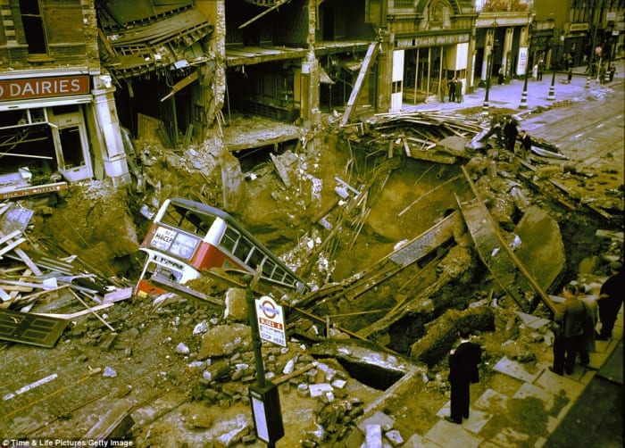 Tragic event at Balham Underground Station where a bus fell into a bomb crater breaking a water pipe