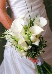 In the classic white bouquet, only a few will be needed with some floral accents and variegated foliage. It creates a fresh and artistic flower bouquet that won't look fussy or "over the top".