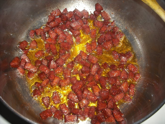 Heat the oil over medium-high heat and sauté the soujouk until crispy around the edges.
