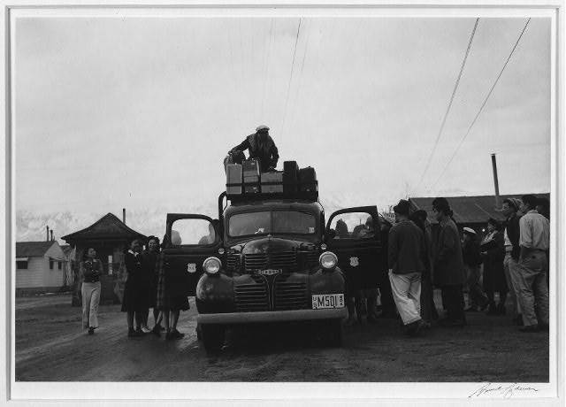 Leaving Manzanar to return home. Photograph by Ansel Adams.