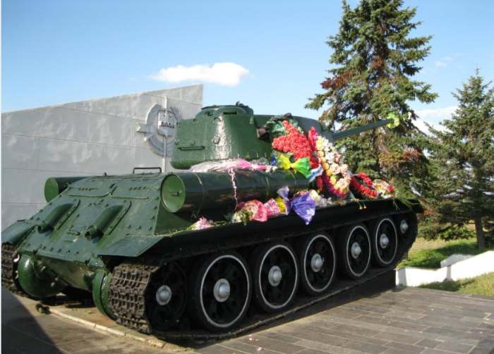 Soviet Tank at World War II Memorial in Field Outside Veliky Novgorod, Russia, Veliky Novgorod is south of St. Petersburg and was captured by Germans who destroyed much of the city.
