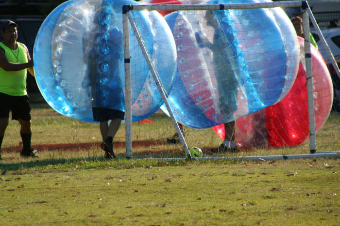 The blue team scored a goal. Instead of jumping, slapping and hugging each other, the best they could manage was a plastic 'shoulder rub' while other team members took a celebratory roll. :)