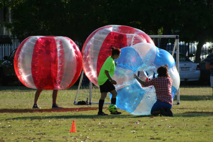 Bubble soccer players need to be comfortably positioned within the bubble and firmly holding the handles before the game begins. There's not much room for readjustment once the player is upright.