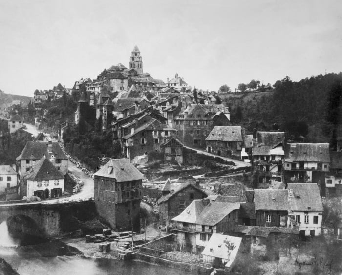I find this one to be absolutely fascinating, with the river and bridge in the corner, to the details of the windows on the buildings. Very beautiful and interesting, and so much texture.