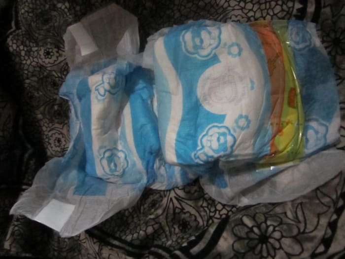I went through a lot of YouTube videos with advice on how to cut dog diapers. However, there was the constant problem of leaks and fallen turds. The best advice was: DON'T cut on the side of the diaper where the stickers are. Cut on the opposite.