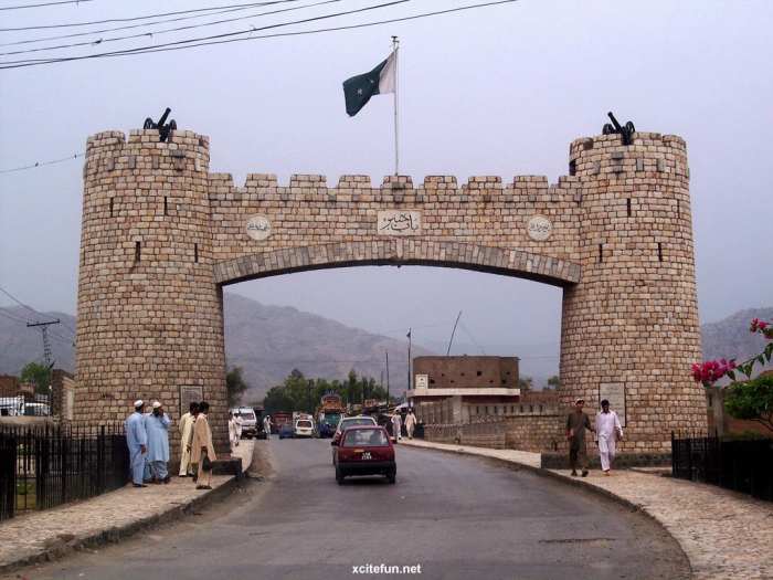 The border crossing between Afghanistan and Pakistan (showing the Pakistan flag) along the world famous Khyber Pass which is also a NATO Supply Route. The Khyber pass also carries the famous Grand Trunk Road which has existed since the 16th Century.