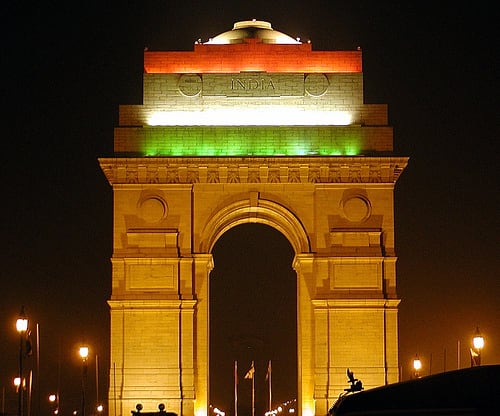 The India Gate Cenotaph (decorated with the Indian flag color scheme) at New Delhi, India.