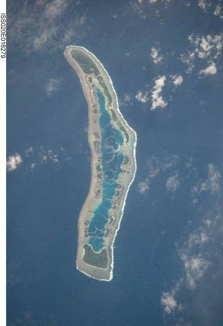 Satellite image of Caroline Island (Line Islands, Kiribati) which at roughly 9 Degrees South and 150 Degrees West, is the easternmost point on Earth (based on its UTC + 14 Time zone)