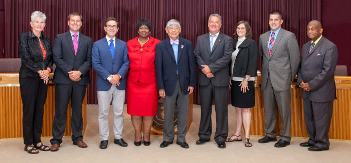 2014 City Council of Pensacola Florida smiling broadly as they are proud to have passed laws forbidding homeless people to have blankets or to cover themselves with anything as protection from the cold or weather.