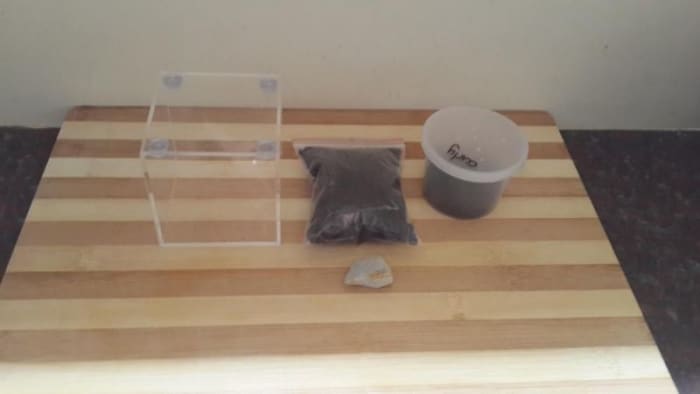 After buying from right to left that's the small bucket i got my sling in, my peat, a rock and a small glass enclosure for my new sling