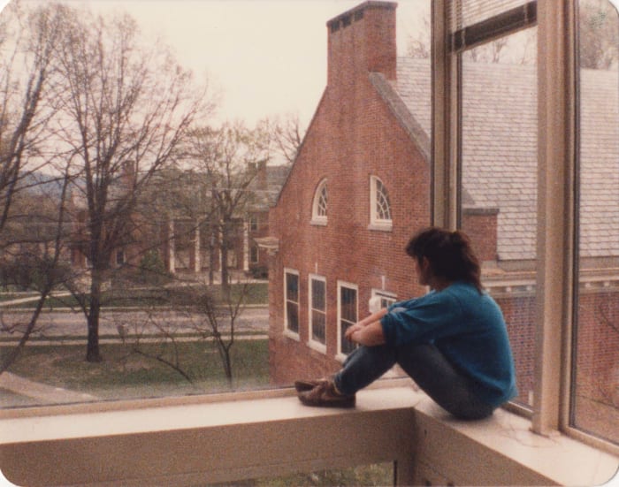 Student enjoying the view looking south from the airy Traylor Art Building, past the Rogers Art Building towards Presser Music Hall.