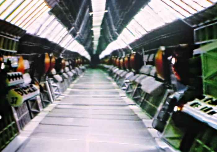 The corridor was about one and a half feet high and twelve feet-long. The corridor was divided down the middle and each side was devised into eight food and a half long sections. This set-up enabled technicians to shoot only one side of the corridor,
