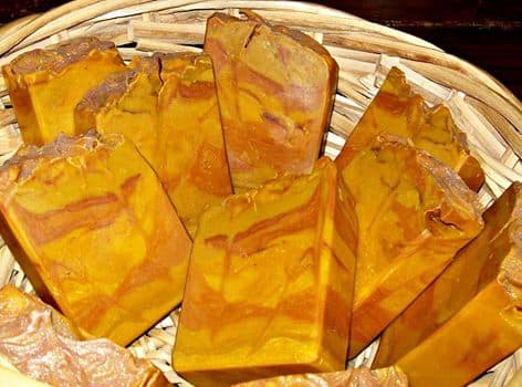 Red Palm Oil Soap, scented with Brambleberry's Ancient Sedona and colored with red clay, rose clay, purple Brazilian clay, red oxide mixed with yellow oxide, ultramarine lavender, ultramarine pink.