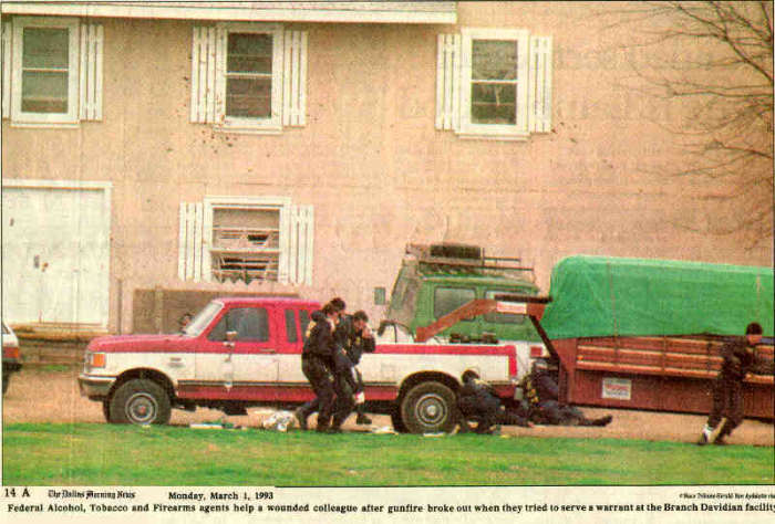 BATF agents helping one of their colleagues to safety, after he was shot during their attempt to serve a search warrant.