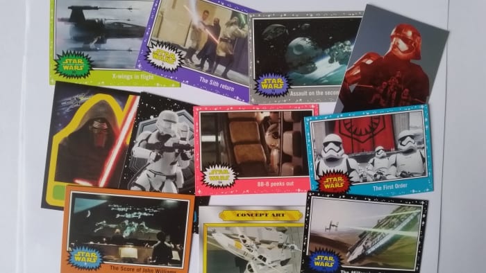 The US Version of the "Star Wars - Journey to the Force Awakens" above, offer a much wider variety of base and chase cards, including actual scenes from the forthcoming film and also include the chance of autograph & sketch cards. unlike the UK set.